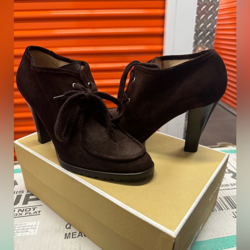 Brown Michael Kors heeled moccasin ankle boots